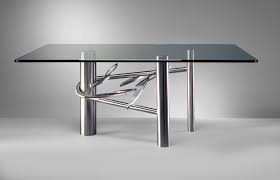 Versatile for both indoor and outoor use. 20 Sleek Stainless Steel Dining Tables