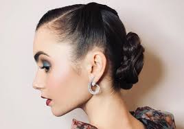 It is as simple as braiding a side braid that you further bring around your head to the nape where you loosely pin twisted pieces of hair. 30 Modern Ways To Wear 50s Hair