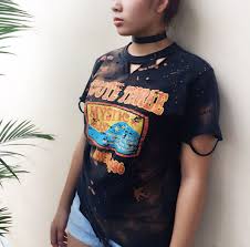 But you don't need to be a rockstar or a vintage collector to admire the distinct style of distressed fabrics. Diy Distressed Bleached T Shirt Diy Clothes Refashion Refashion Clothes Bleach T Shirts