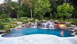 The sound of flowing water exudes a calm and relaxing atmosphere. Backyard Swimming Pool Waterfall Design Bergen County Nj Modern Pools New York Von Cipriano Landscape Design Custom Swimming Pools