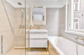 Clean Bathtub Located Near Shower Box