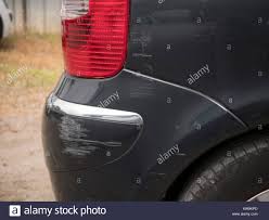 Scratches On The Rear Wing Of A Black Car Stock Photo