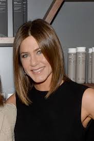 Layered dark brown hair with blonde highlights. A Guide For Blondes Going Back To Their Natural Color