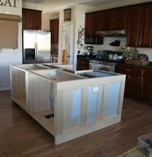 Use straight cuts on plywood and stock boards to wrap the cabinets. Ikea Hack How We Built Our Kitchen Island Jeanne Oliver