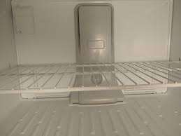 ice on floor of top freezer in fridge
