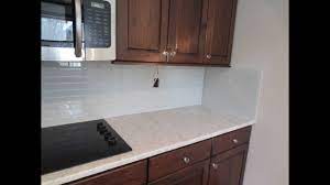 Find written and video instructions on how to install a tile backsplash from the diynetwork.com. How To Install Glass Tile Kitchen Backsplash Youtube
