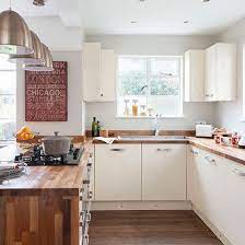 Choose from a wide range of similar scenes. Cream And Woodblock Worktop Kitchen Kitchen Decorating Ideal Home White Modern Kitchen New Kitchen Cabinets Kitchen Remodel