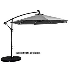 white patio umbrella with solar lights