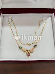 18kt gold necklace with diamonds gems