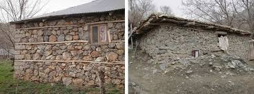 a a stone masonry building with wooden