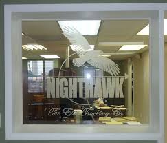 company logo etched on glass by artist