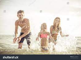 Playful Family Spraying Water Having Fun Stock Photo 276698153 |  Shutterstock