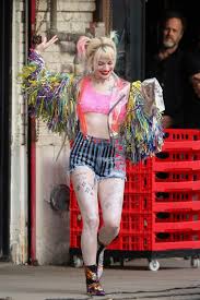 Margot robbie with a revolver hits differentpic.twitter.com/qqrihlzxms. Margot Robbie Struts In Ripped Hotpants And Huge Tasselled Sleeves As She Transforms Into Harley Quinn In La