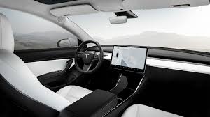 The backs of the vehicle seats are black and so shiny you can use them as mirrors. Tesla Is Trying To Reinvent Car Seats With Skin Foam