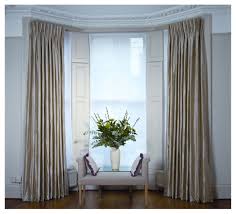 hang curtains in a bay window