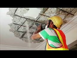 removing spalling concrete ceiling for