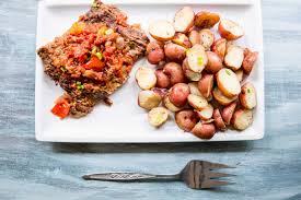 Add in flank steak and let it marinate together for a few minutes, coating both sides of the steak. One Pot Instant Pot Swiss Steak And Potatoes Recipe