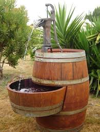 Incorporate Wooden Barrels In Your Yard