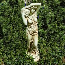 A wooden angel for your garden that is made to look rustic. How To Make A New Garden Ornament Look Antique Dengarden