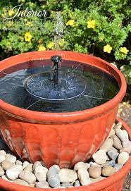 An old galvanized tub transformed into a beautiful outdoor solar fountain with pond and water plants in 1 hour using a solar pump! Solar Plant Pot Water Fountain In Under 15 Minutes Interior Frugalista