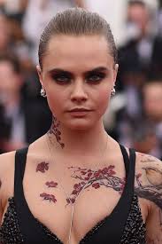 One of cara delevingne's newest tattoo was unveiled on instagram on october 1, 2016 and revealed a pair of eyes eyes on the back of her neck. You Won T Believe How Much Cara Delevingne Has Changed Over The Years Cara Delevingne Tattoo Cara Delevingne Hair Cara Delevingne
