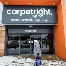 carpetright issues third profit warning