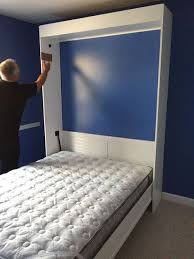 queen size murphy bed opened for the