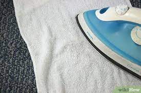 remove a carpet stain with an iron