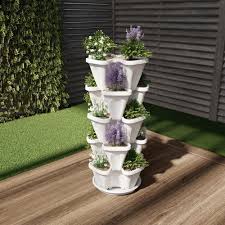 Whether you just want some fresh thyme or you're looking to grow a variety of herbs, there are plenty of gorgeous indoor planters and gardens to shop. Pure Garden White Plastic Vertical Stacking Planter Tower 5 Pack Hw155008 The Home Depot Pure Garden Vertical Garden Vertical Planter