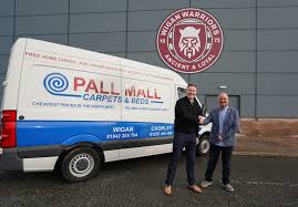 wigan partner with pall mall carpets