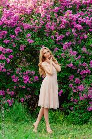 Beautiful Woman Enjoying Lilac Garden