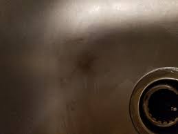 To remove oil stains you should pretreat the stain with a pretreatment spray or by rubbing it with liquid laundry detergent. How Do I Remove A Burn Mark From My Stainless Steel Sink A Friend Decided To Set Polaroids On Fire In It Howto