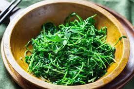chinese stir fried pea shoots steamy