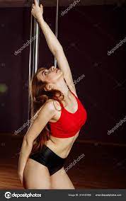 Sexy pole redhead dancer showing her body. Sexy shoot of female Stock Photo  by ©s.o.student@mail.ru 319142056