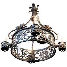 Solid mini crosses and onyx socket covers or shades are optional features that can be added. Spanish Handwrought Iron Chandelier Circa 1910 For Sale At 1stdibs