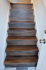 Next ensure that the underlayment is perfect to avoid lumps. A Diy Install Of Peel And Stick Wood Look Vinyl Flooring On Our Back Stair Faux Wood Tiles Wood Stairs Peel And Stick Wood