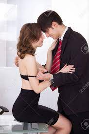 Young Businesswoman Seducing Her Boss In The Office Stock Photo, Picture  and Royalty Free Image. Image 27241708.