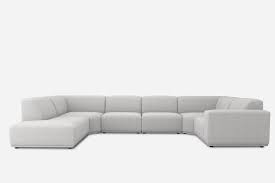 A rounded sofa offers a clean profile alongside a circular coffee table. The 17 Best Sectional Sofas Of 2021