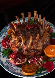 Serve up a spread of hearty fare this holiday season. Crown Roast Of Pork With Pomegranate Recipe Crown Roast Of Pork Christmas Dinner Menu Christmas Food Dinner
