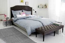 Gray Upholstered Bed In A Bright Room