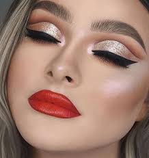 red lips gold eyeshadow and shimmer