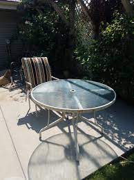 Patio Glass Table An Four Chairs For