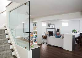 Basement With Glass Staircase Wall