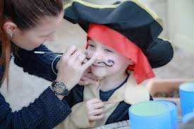kid wearing pirate costume makeup