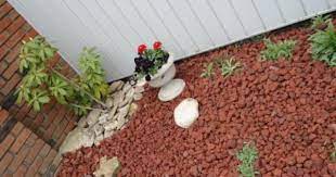 If you have a garden but you dont want to spend a lot money to decorate it rocks and stones may be a good idea for you. Vigoro 0 5 Cu Ft Bagged Decorative Stone Red Lava Rock 440897 The Home Depot Stone Landscaping Fall Landscaping Landscaping With Rocks