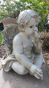 cherub erfly garden statue on