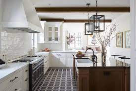 transitional white kitchen with a black