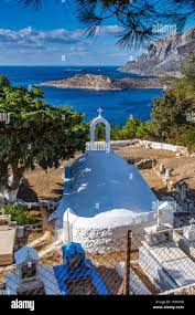 Agios Ioannis church, with old stone walls and pillars Melitsachas harbour  harbour, Myrties, Kalymnos, Greece Stock Photo - Alamy