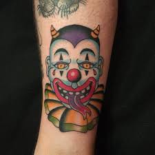It wears crazy colorful face paint and 🔴 red 👃 nose and it smiles widely. Cute Clown Tattoo By Natefierro Woohoo Instagram Com Natefierro Clown Tattoo Old School Tattoo Designs Tattoos