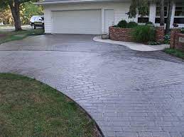 stamped concrete vs pavers pros cons